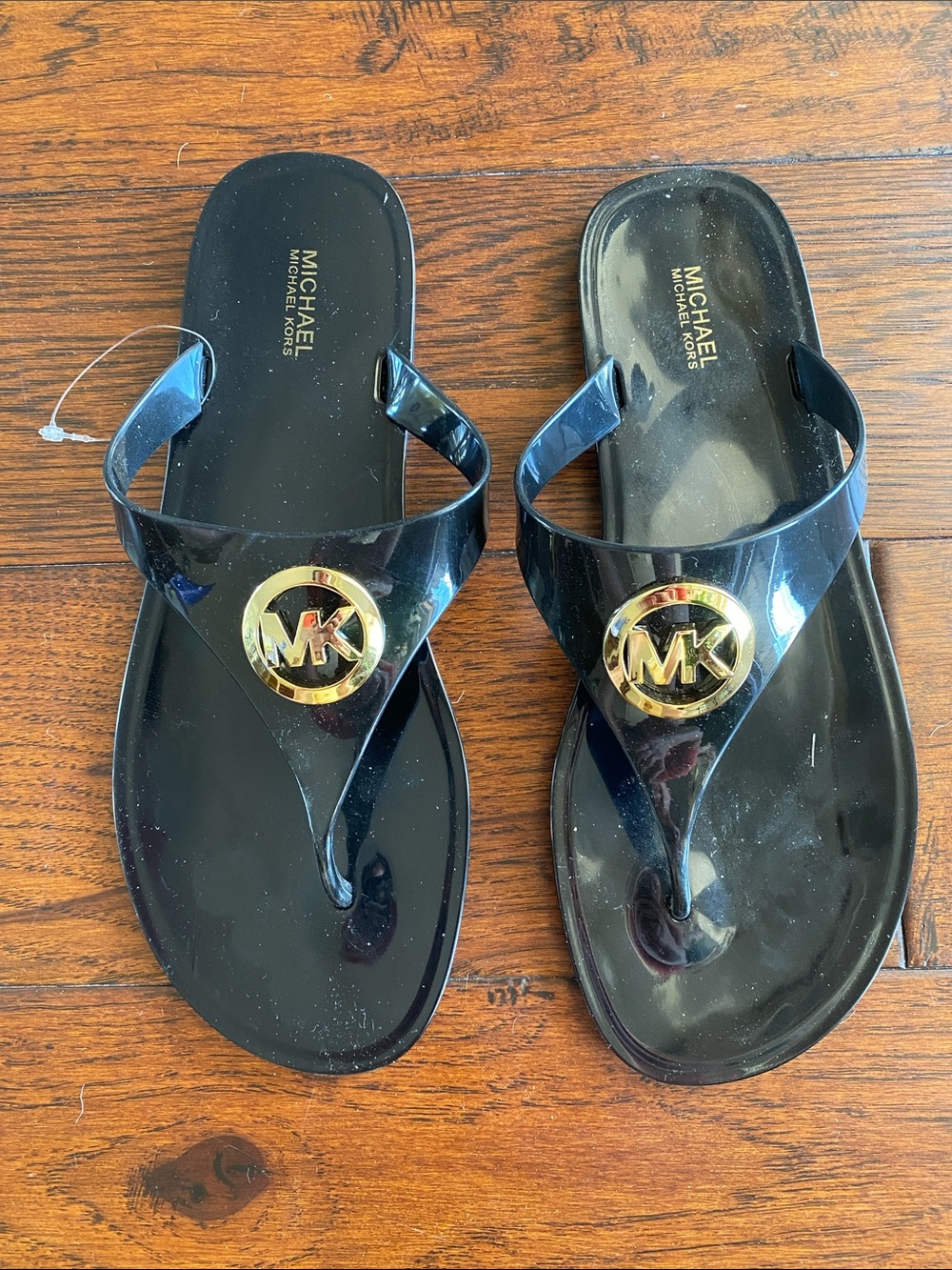 Michael Kors Black Jelly Thong Sandals with Gold MK Medallions